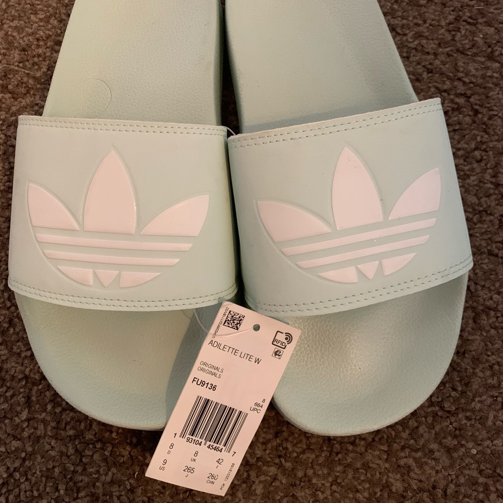 Light blue adidas slides